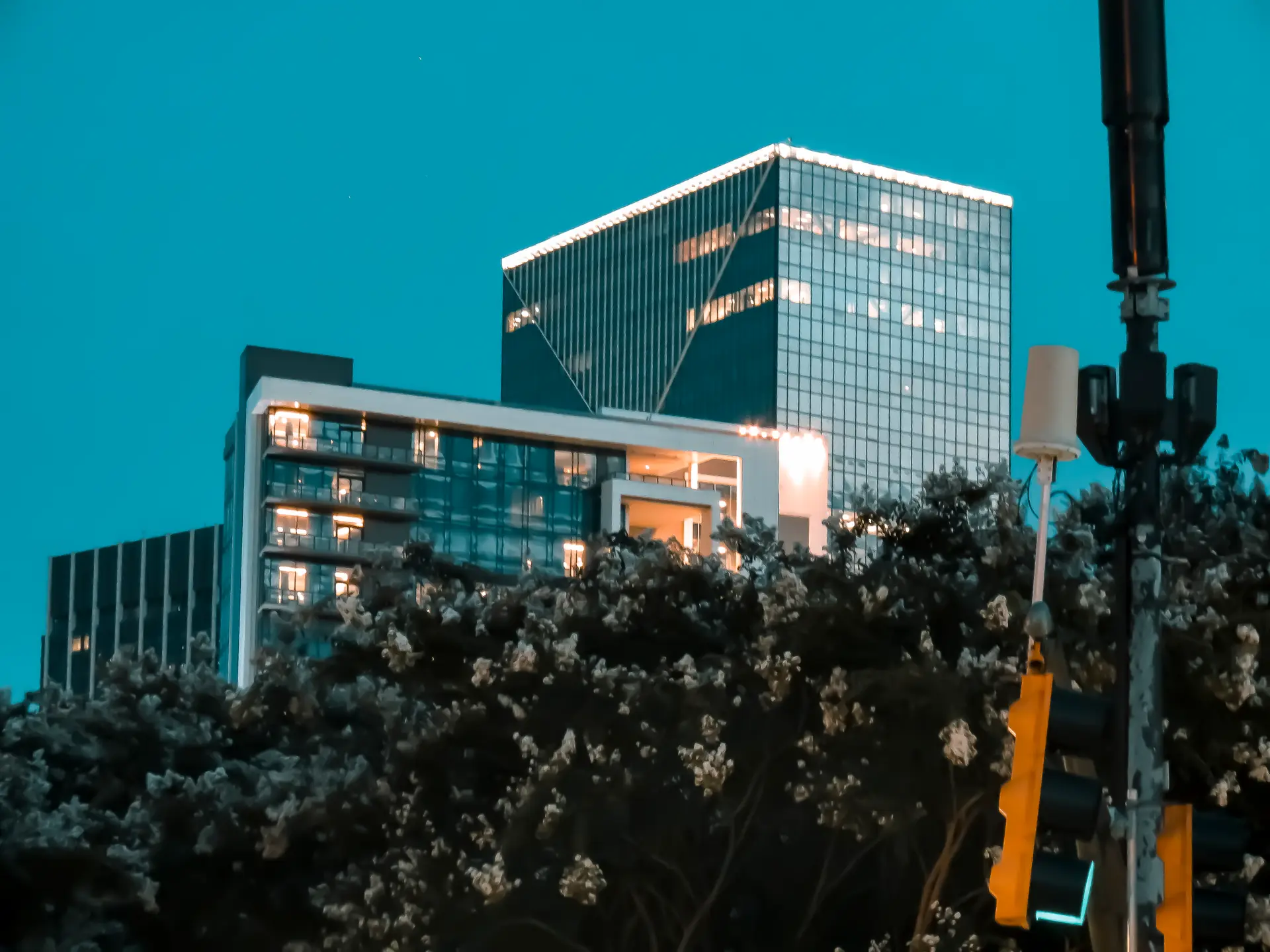 Glass office towers in Atlanta reflecting the blue hour sky