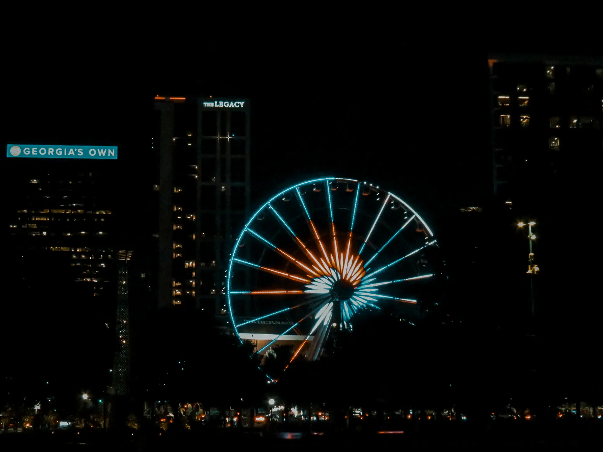 The SkyView ferris wheel lit up at night in downtown Atlanta